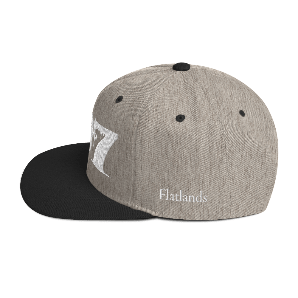 Side view of Deadpan Couture 707 Classic Snapback Hat in black with 'Flatlands' embroidered in white.