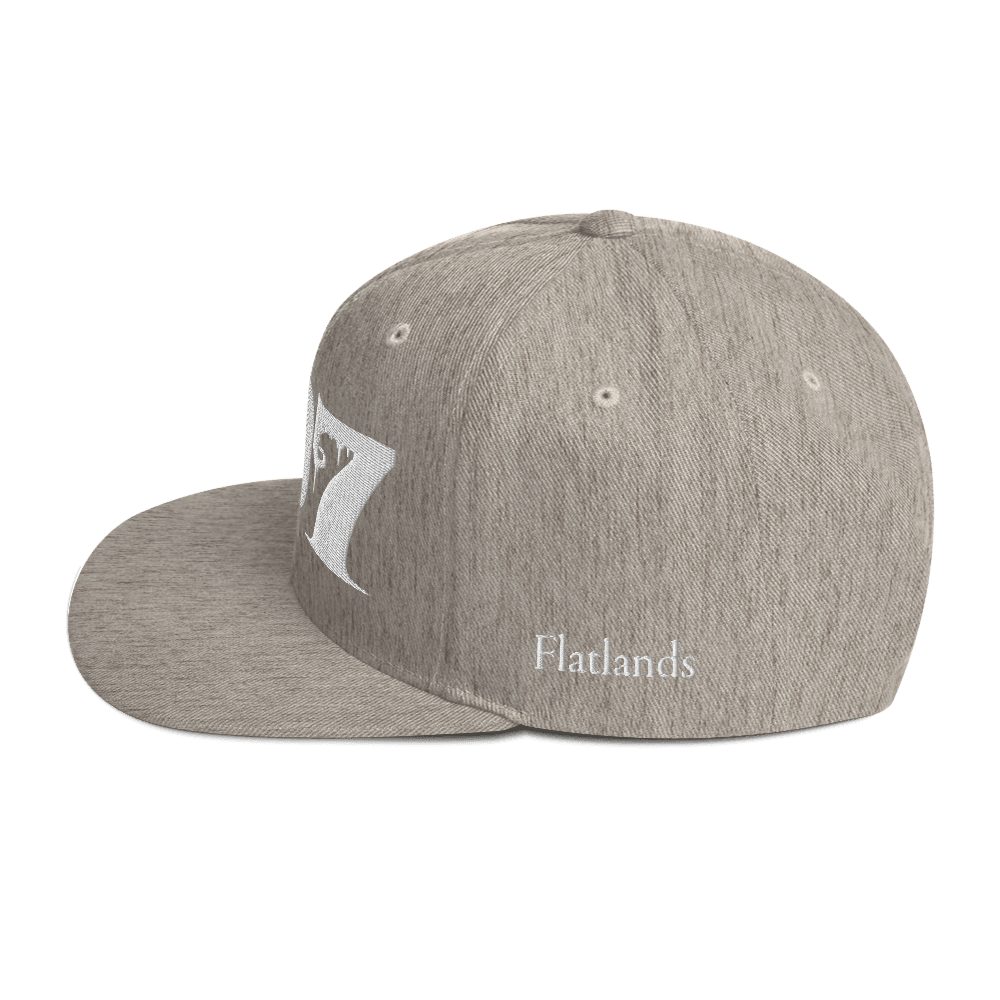 Side view of Deadpan Couture 707 Classic Snapback Hat in black with 'Flatlands' embroidered in white.