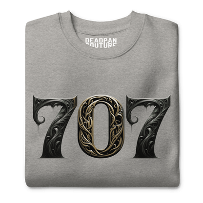 Grey sweatshirt featuring a bold "707" graphic on the front, designed with intricate baroque elements, showcasing Deadpan Couture's edgy streetwear style.